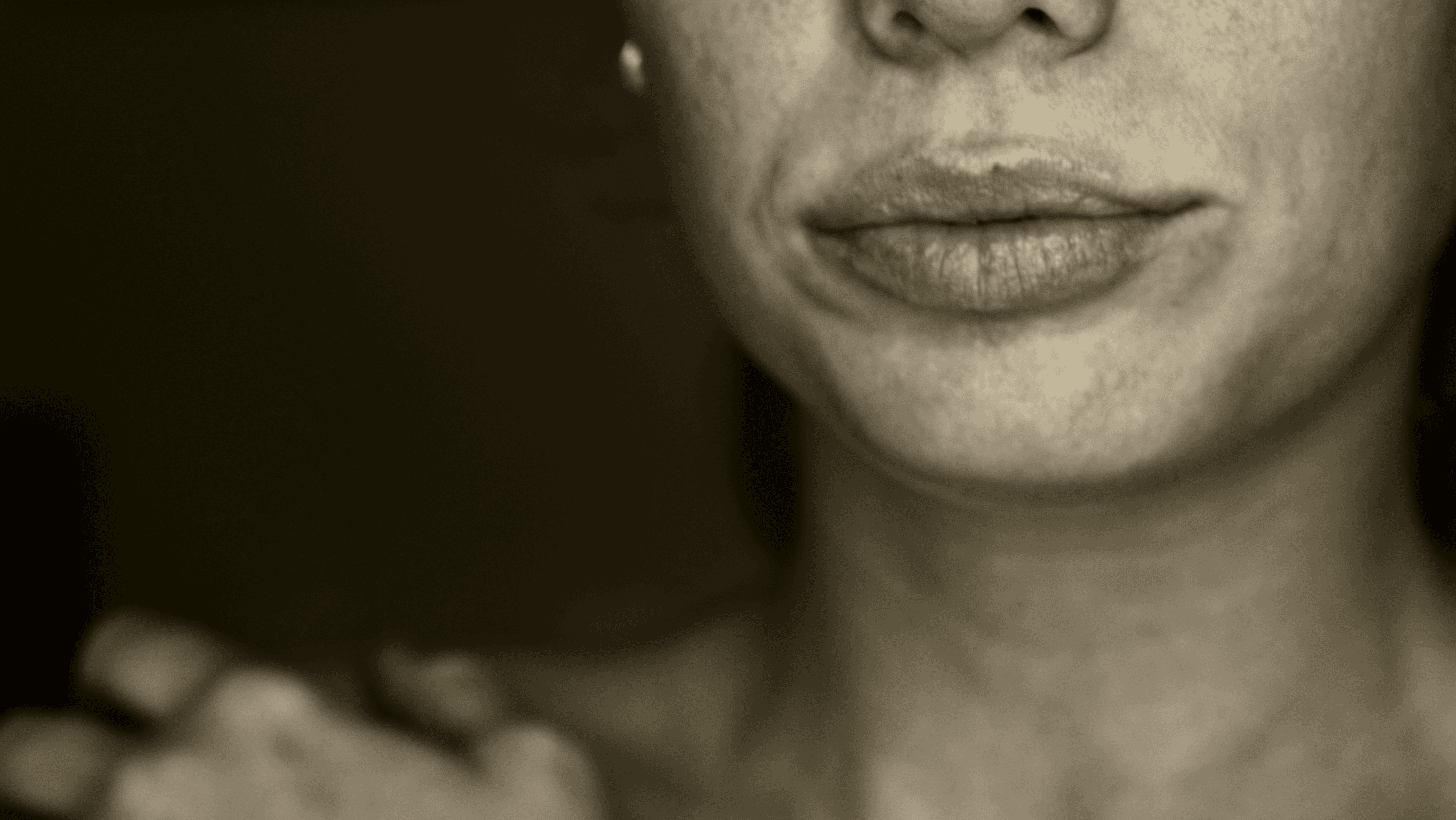 Warm editorial close-up portrait detail representing women’s health, menopause, and longevity.